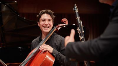 Guildhall School cello player smiling at colleague